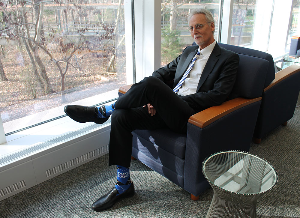 Dean Bill Boulding sitting in Ford Library
