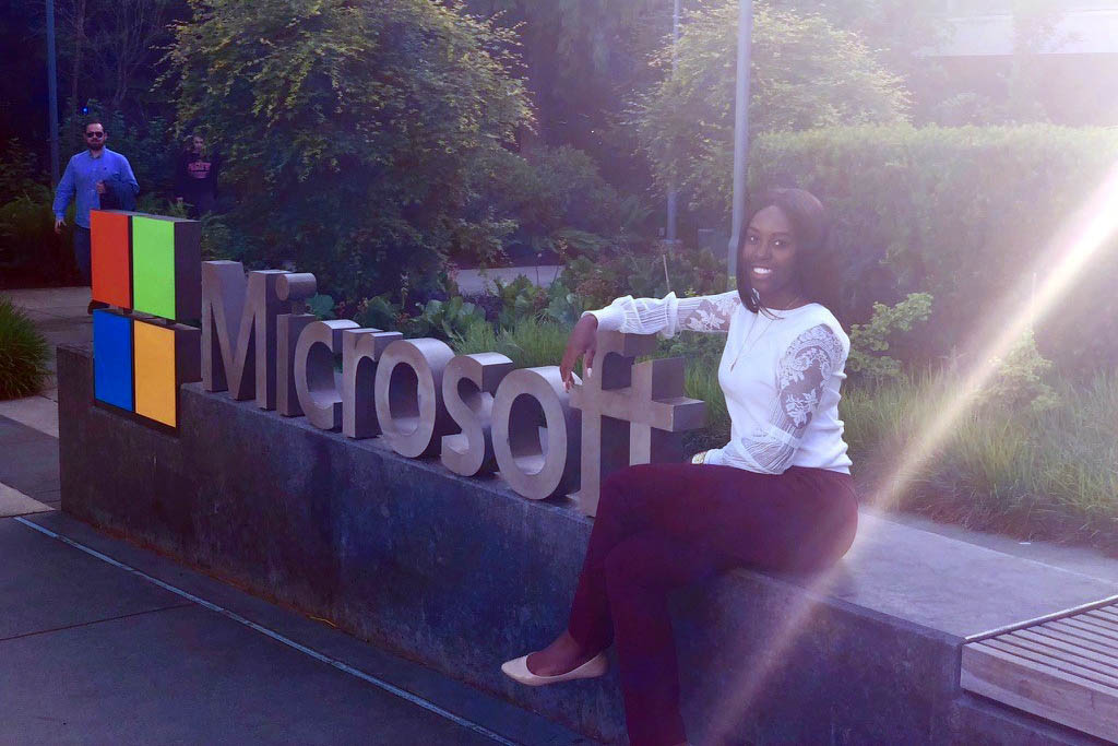 Fuqua alum Tiffany Ellis in front of Microsoft sign