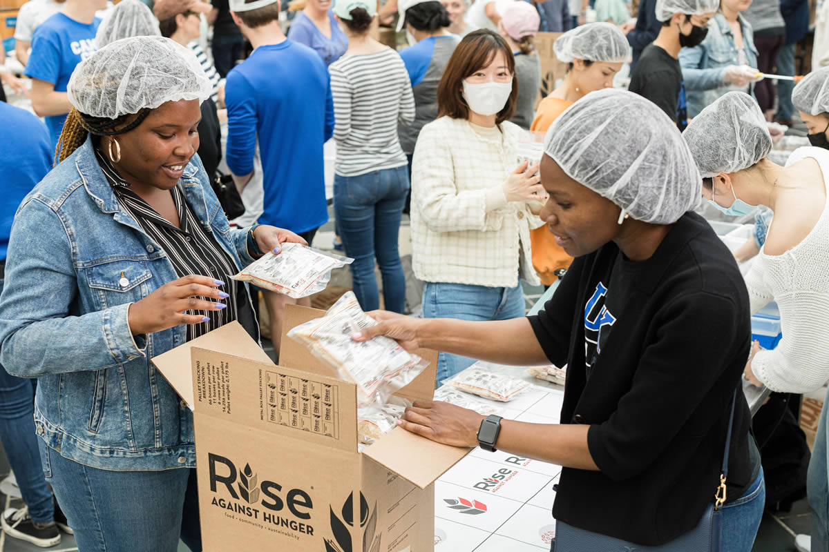 Students Packaging Rice at Rise Against Hunger Event