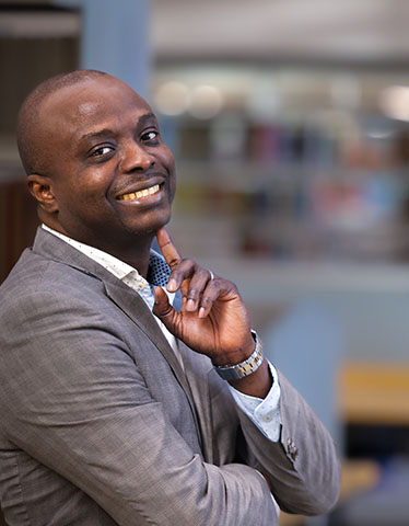 Portrait of Toba Oyewunmi, a student in the Weekend Executive MBA program at The Fuqua School of Business.